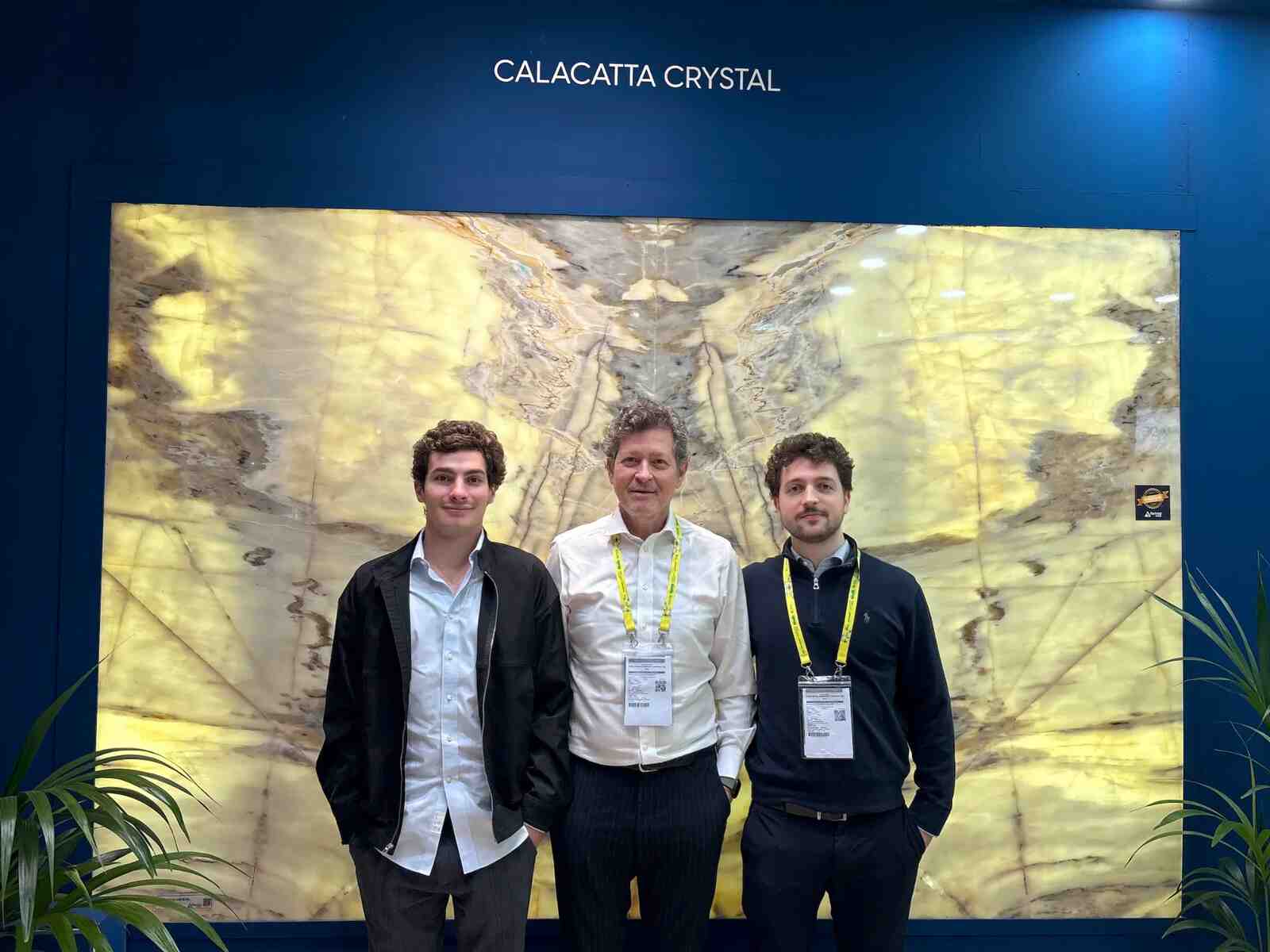 The Ferraz family in front of a Calacatta Crystal slab